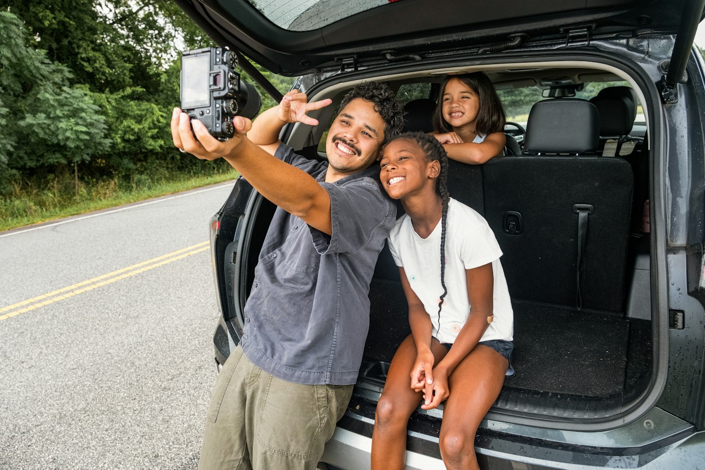 Family on a road trip with their SUV